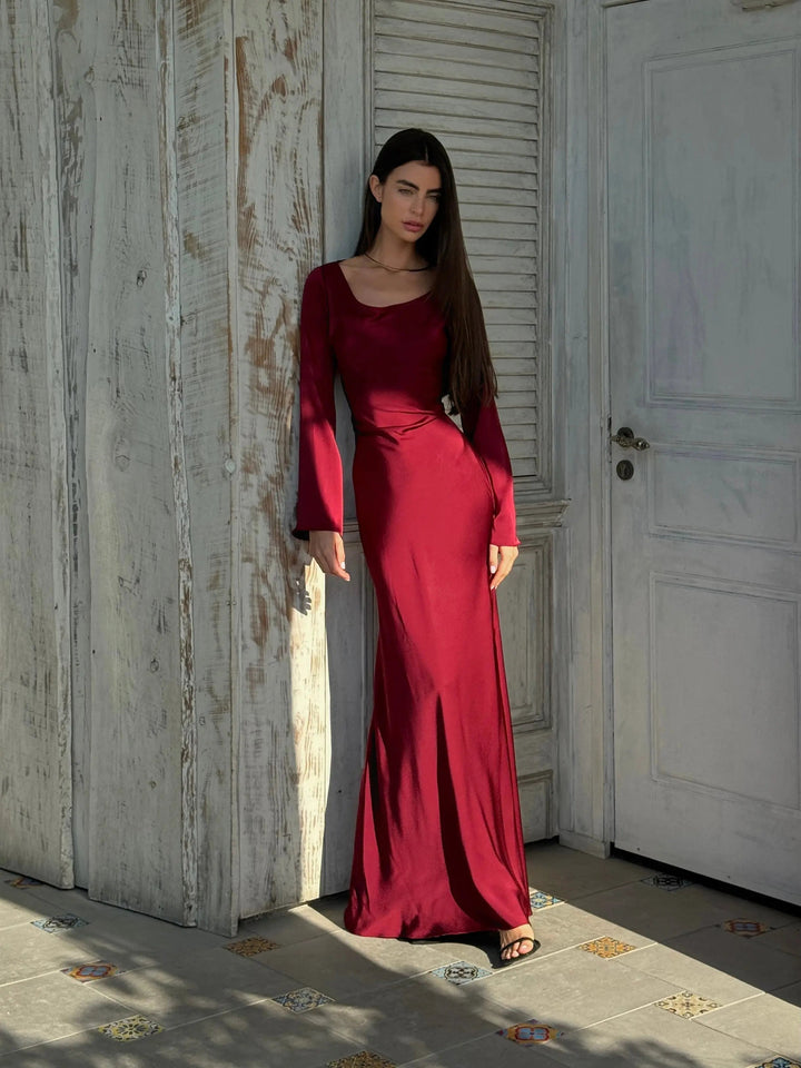 Sophisticated women's flowing maxi dress with long sleeves, perfect elegant evening wear or special occasion gown.
