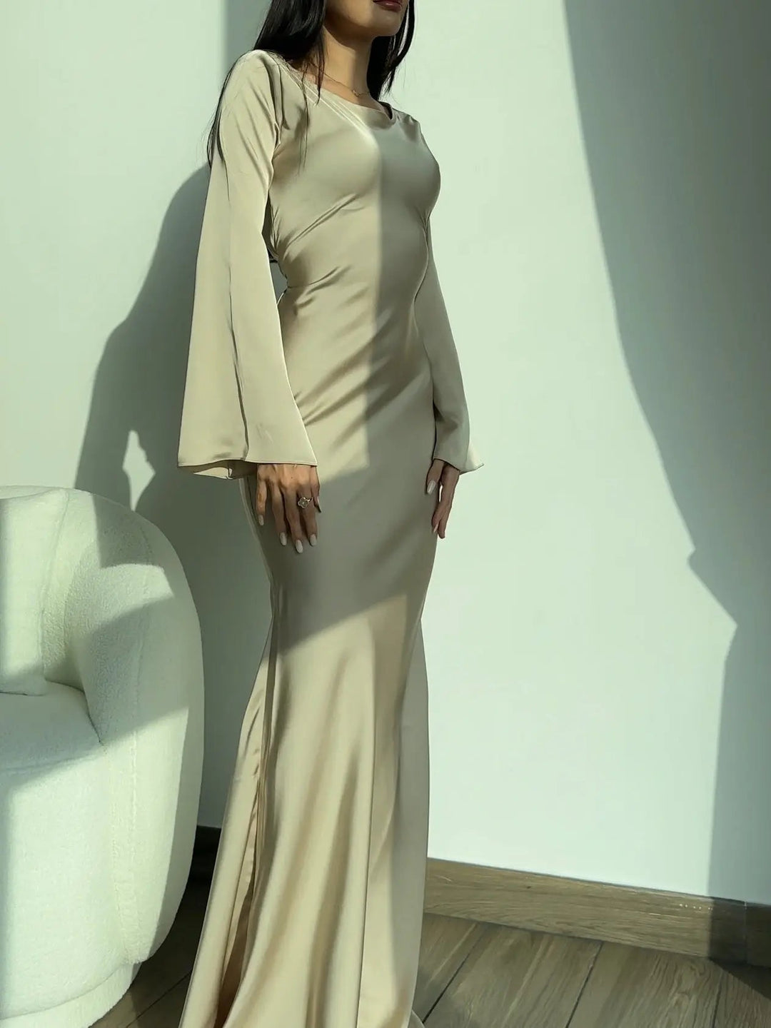 Women's elegant maxi gown featuring long sleeves & a flowing silhouette, perfect for formal events & parties.
