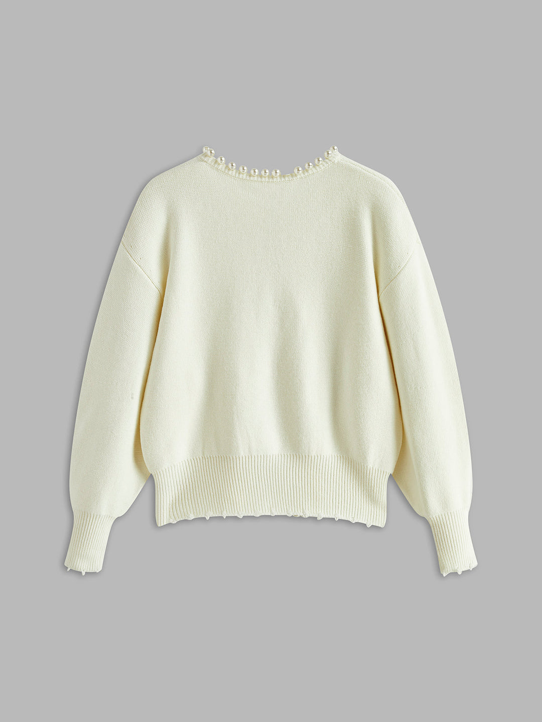 Black women's elegant cardigan featuring delicate pearl trim. A sophisticated round neck layering sweater.