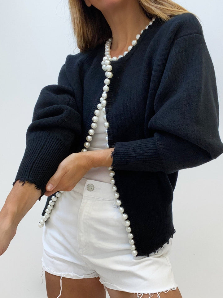 Elegant women's pearl trim cardigan. A chic, versatile one-size sweater, perfect as a sophisticated layering piece.
