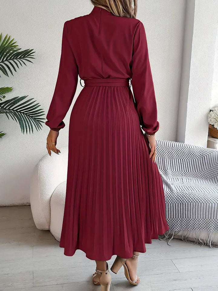 Women's elegant pleated midi dress, perfect as a wedding guest dress, with belt.