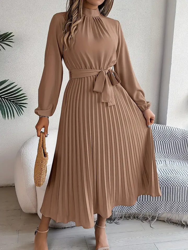 Women's party dress: elegant pleated midi, long sleeves, and a flattering belted waist.