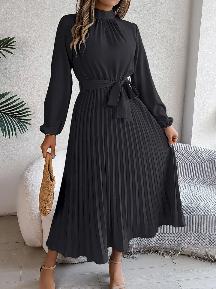 Stylish women's elegant midi dress, pleated and belted, perfect for sophisticated events.