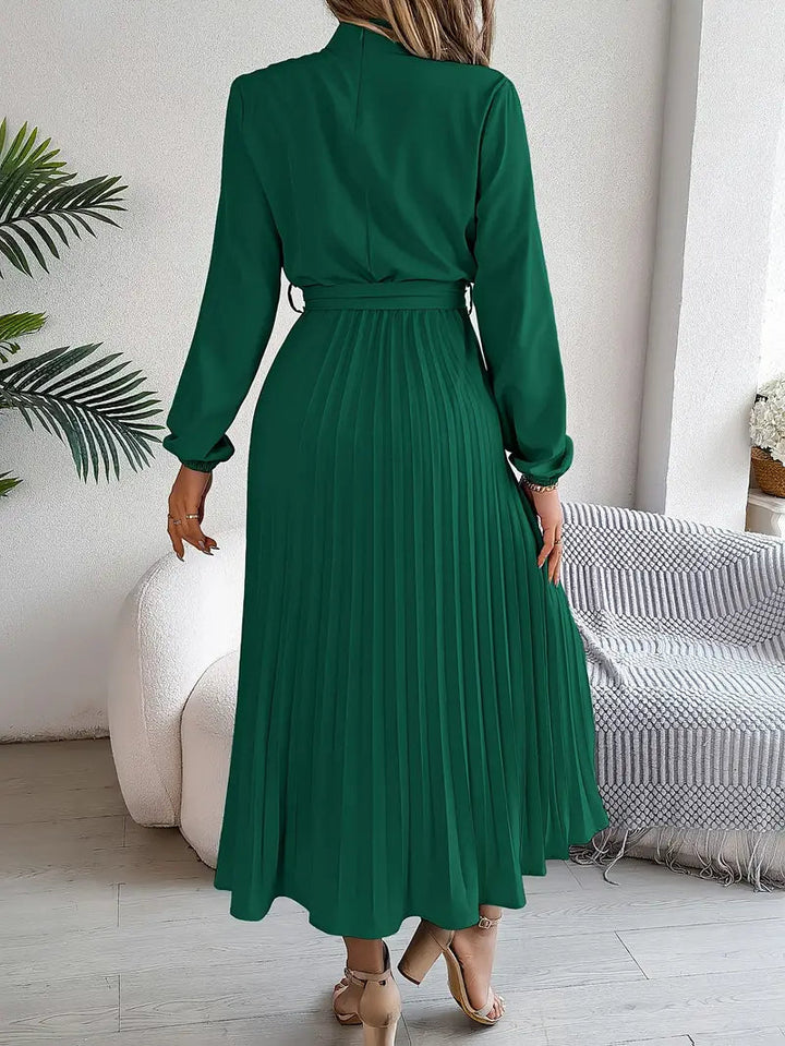 Pleated midi dress for women, elegant design with a flattering belted waist.