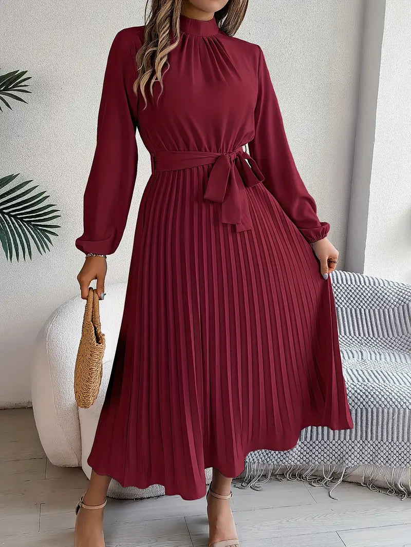 Long sleeve pleated midi dress, elegant and formal, with a stylish cinched belted waist.