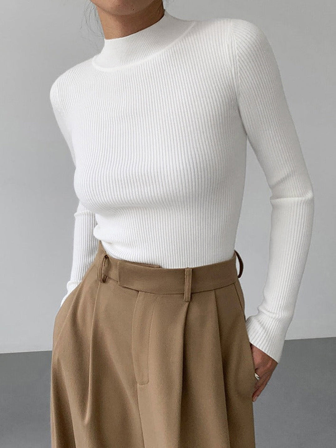 Cozy women's long sleeve ribbed high neck sweater, ideal for everyday style and comfortable layering.