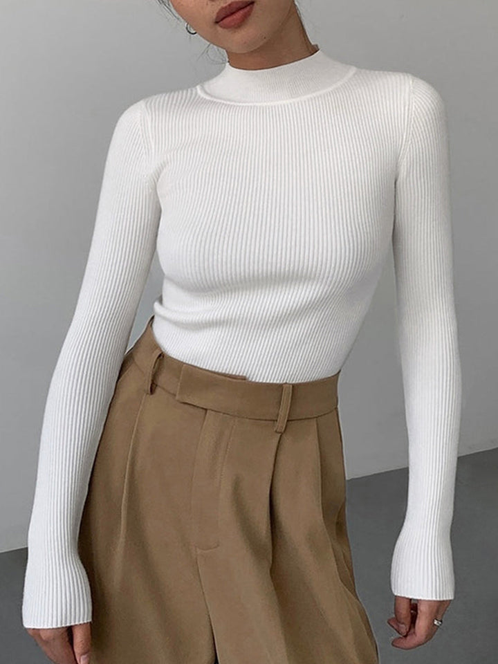 Versatile women's ribbed high neck top, great for layering or standalone, adding chic style to any fall look.