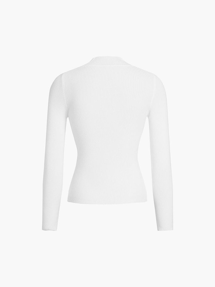Close-up of a women's elegant ribbed high neck long sleeve top, highlighting the cozy texture & quality.