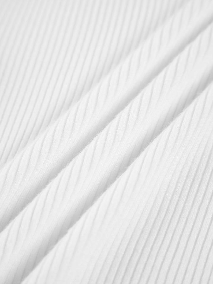 Woman wearing a stylish ribbed high neck top, showcasing its versatile design for everyday wear & layering.