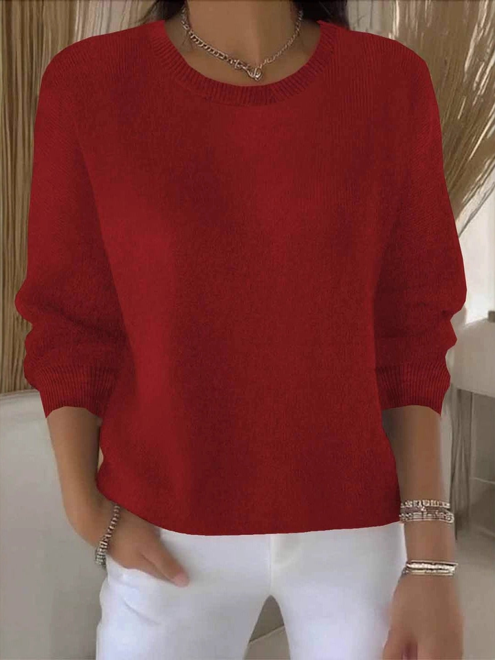 Elegant women's knit sweater. Sophisticated long sleeve top, comfort wear for chic everyday style.