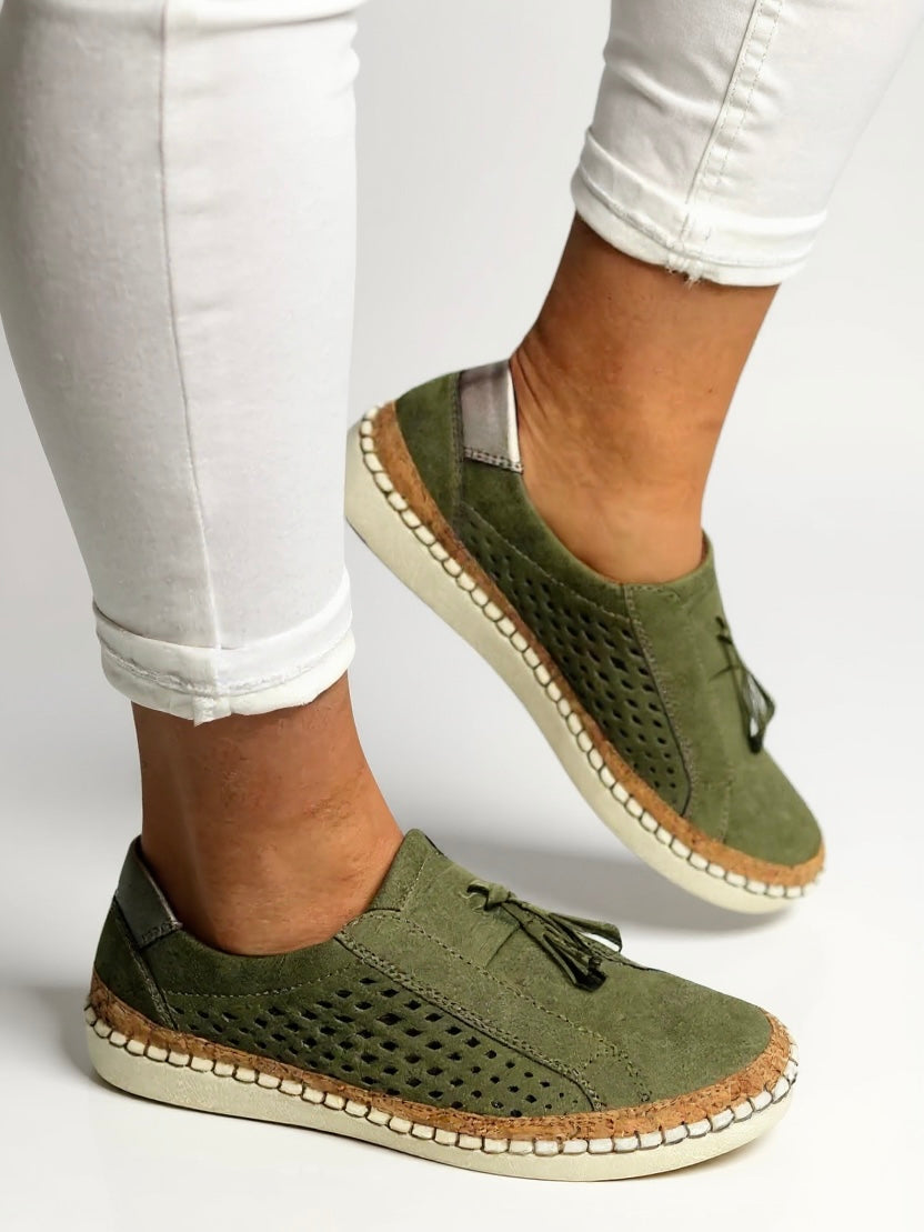 Close-up of women's sophisticated tassel slip-on shoes. Premium comfort flats, ideal for smart casual.