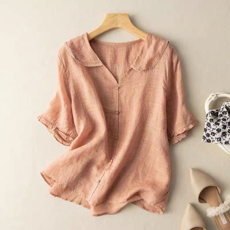 Flattering women's vintage top with front buttons, a timeless classic piece for casual or dressy occasions.