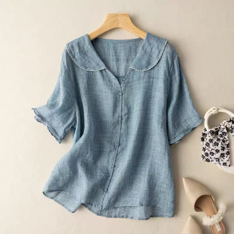 Chic women's button-front vintage blouse, offering a stylish and comfortable fashion statement.