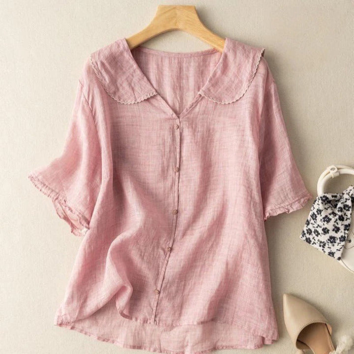Classic women's vintage blouse featuring button accents, ideal for an elegant and timeless wardrobe.