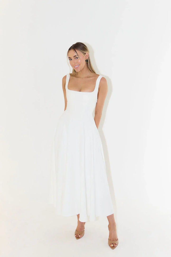 Charming sleeveless white midi dress for women, featuring a square neckline, great for summer events.
