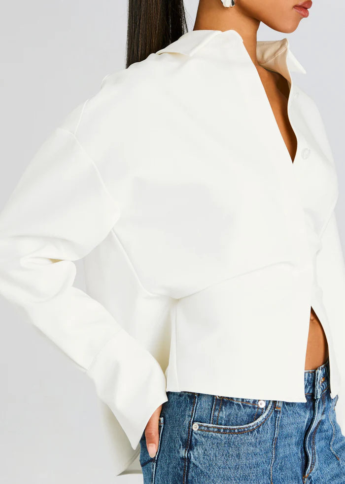 Chic white draped button-down shirt for women. Elegant & versatile blouse, great for office wear & casual outings.