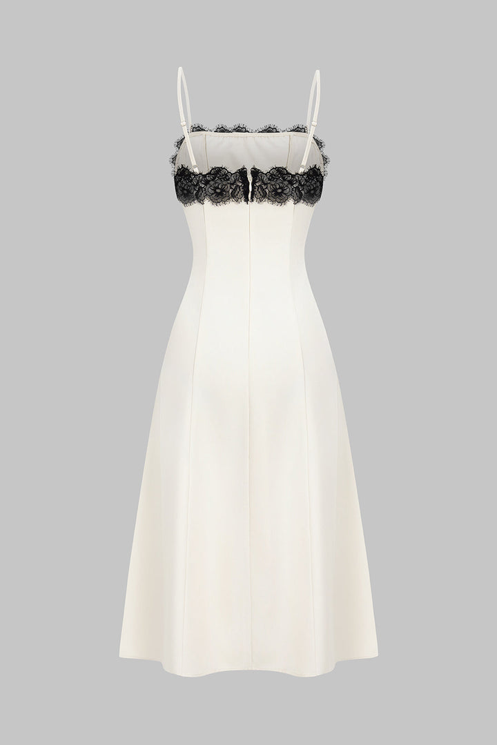 Sleeveless white midi dress for women, featuring a chic black lace design, ideal for formal wear & special occasions.