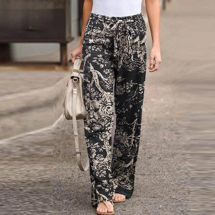 Comfortable women's floral print wide-leg pants with a chic bow, versatile for elegant or casual summer wear.