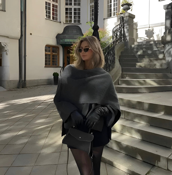 Cozy women's Ella poncho wrap, featuring an asymmetrical design for elegant winter and fall style.