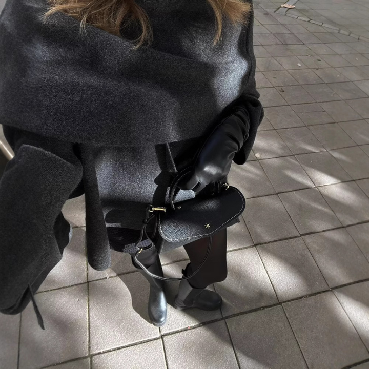 Asymmetrical women's Ella poncho, a stylish winter wrap and cozy outerwear for effortless fashion.