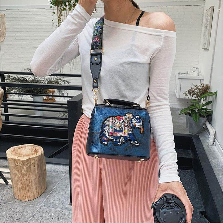 Casual women's crossbody bag with intricate embroidered mandala. Lightweight cotton blend.