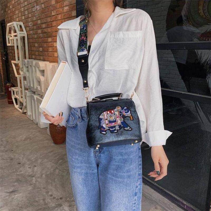 Stylish women's embroidered mandala shoulder bag, ideal for travel. Lightweight cotton blend.
