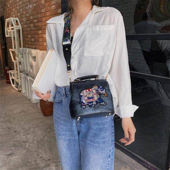 Stylish women's embroidered mandala shoulder bag, ideal for travel. Lightweight cotton blend.