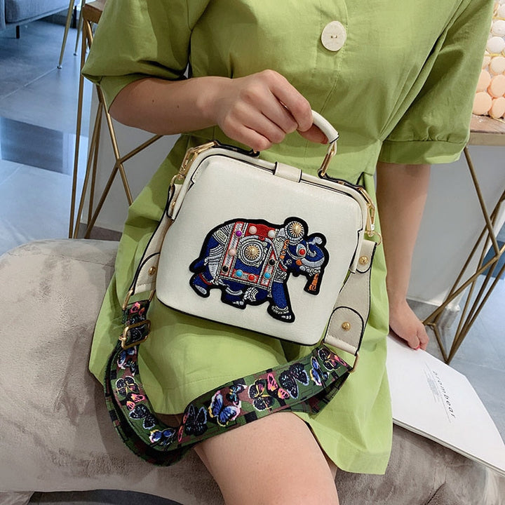 Lightweight women's crossbody bag featuring vibrant embroidered mandala. Bohemian fashion.