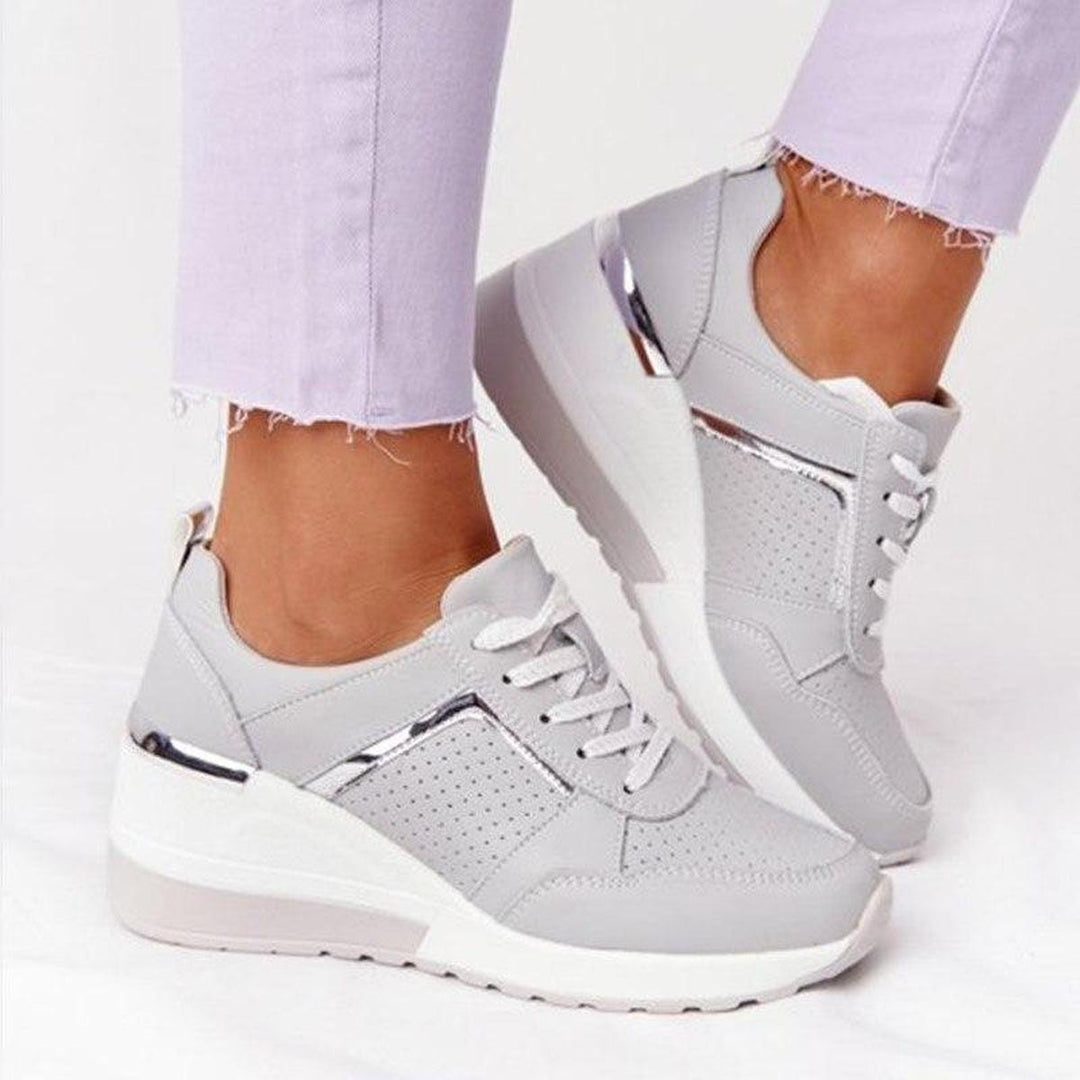 Perforated wedge sneakers for women, offering everyday comfort & stylish support.