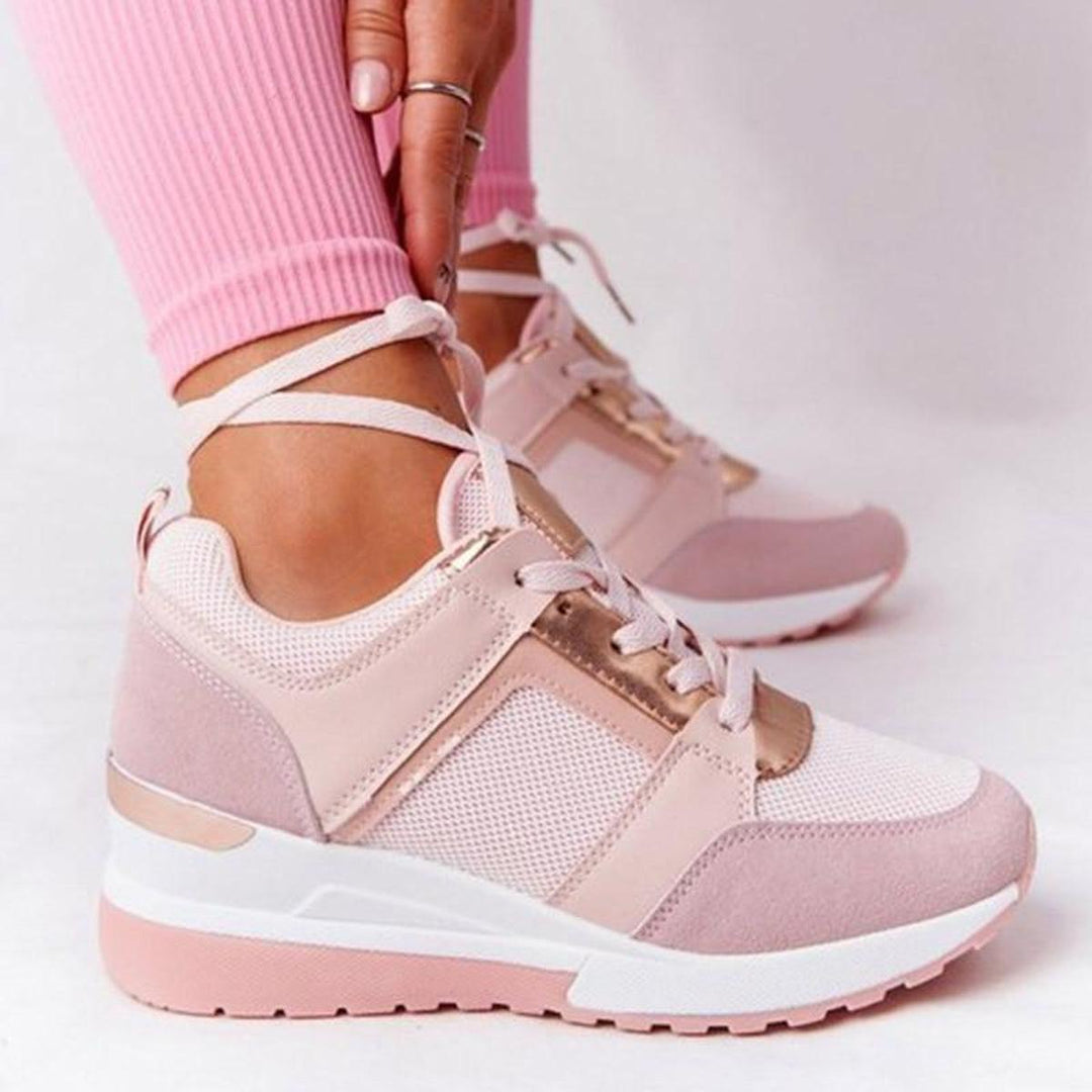 Stylish women's wedge sneakers for everyday comfort & essential foot support.