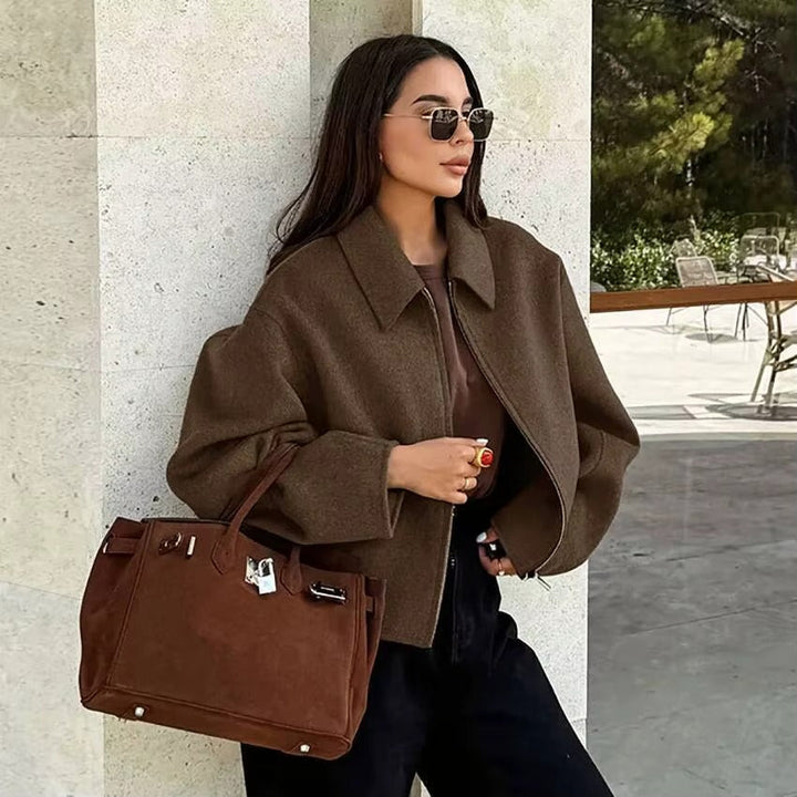 Chic women's jacket featuring a practical zipper collar. Perfect casual outerwear for daily comfort.