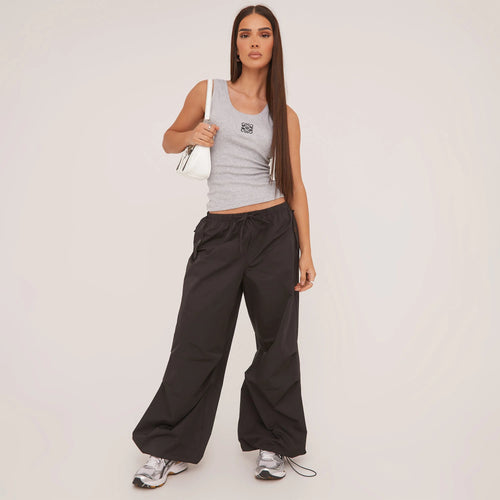Versatile women's fitted racerback tank top, perfect layering piece for summer fashion & everyday style.