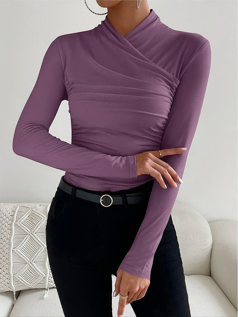 Black women's fitted long sleeve top with a chic wrap neck design, a versatile wardrobe essential for any style.