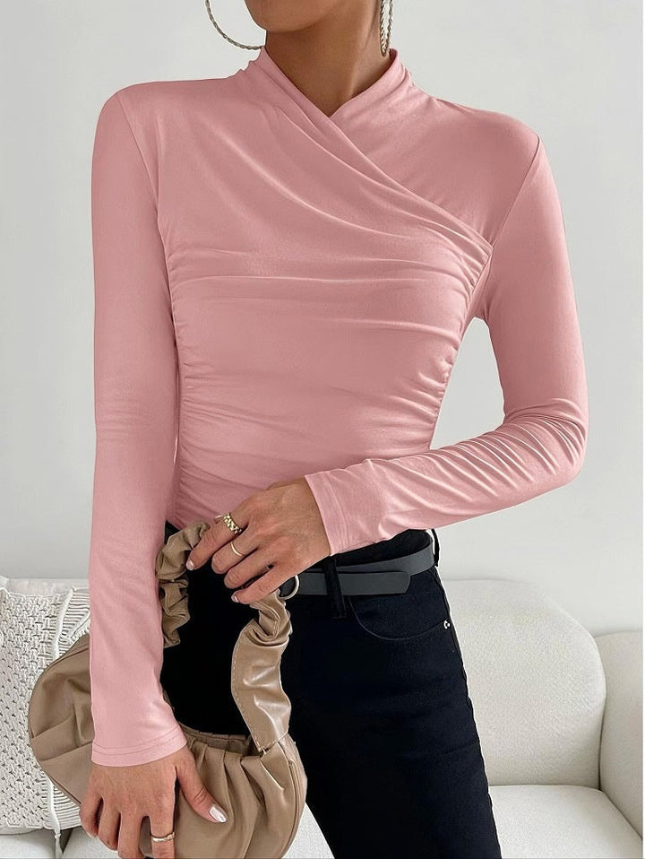 Stylish cream women's fitted wrap neck long sleeve shirt, offering a comfortable stretch and flattering silhouette.