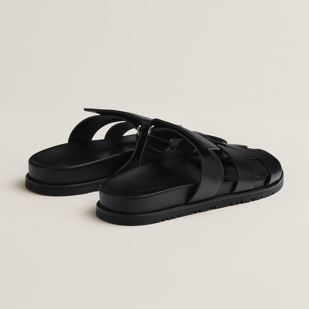 Stylish women's flat open-toe sandals. Easy slip-on design for effortless summer style.