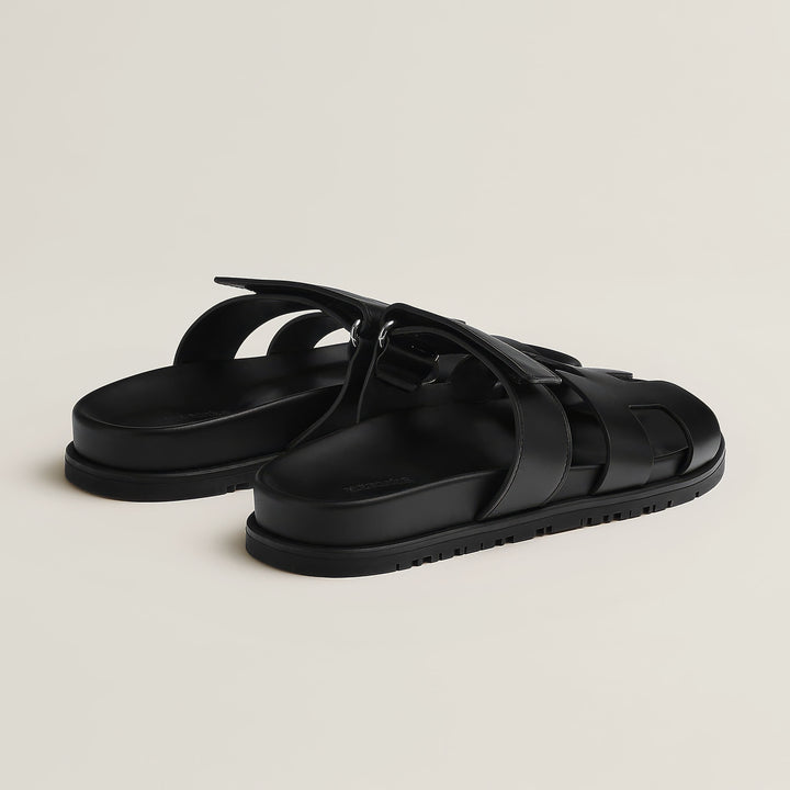Stylish women's flat open-toe sandals. Easy slip-on design for effortless summer style.