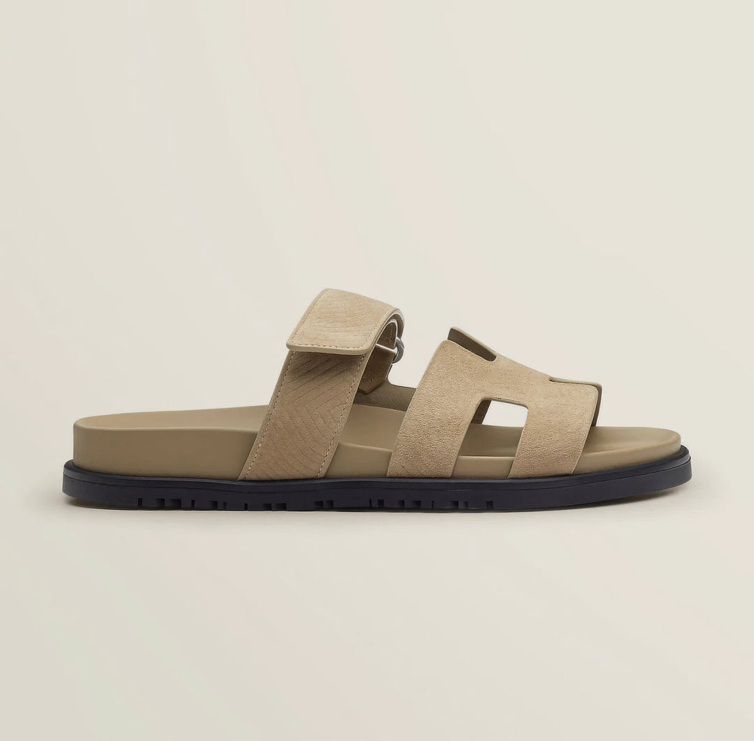Women's summer flat sandals with cut-out detail. Comfortable slip-on for chic casual wear.