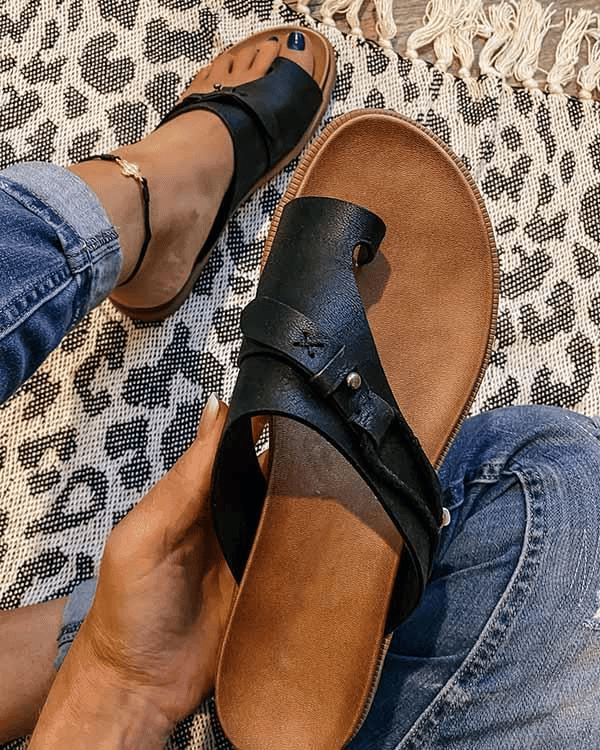 Brown flat toe loop sandals for women. Stylish & comfortable summer shoes, perfect for vacation ready outfits.