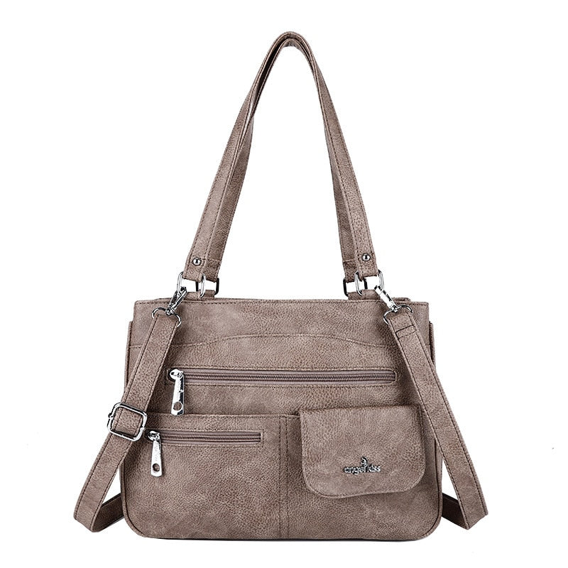 Stylish solid color PU leather crossbody bag, perfect for travel & versatile use.