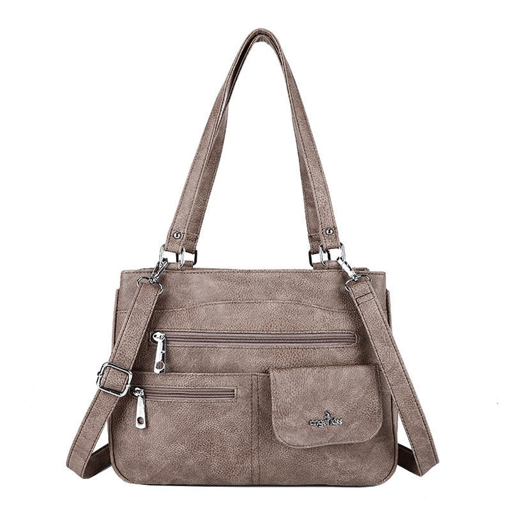 Stylish solid color PU leather crossbody bag, perfect for travel & versatile use.