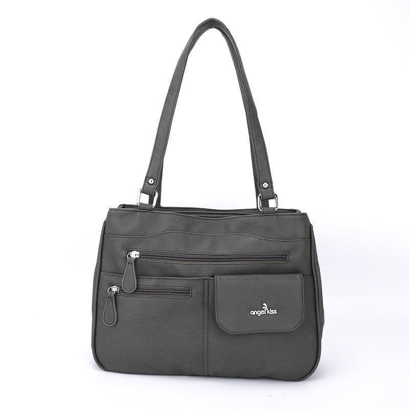Elegant women's shoulder bag with multiple compartments, a chic fashion accessory.