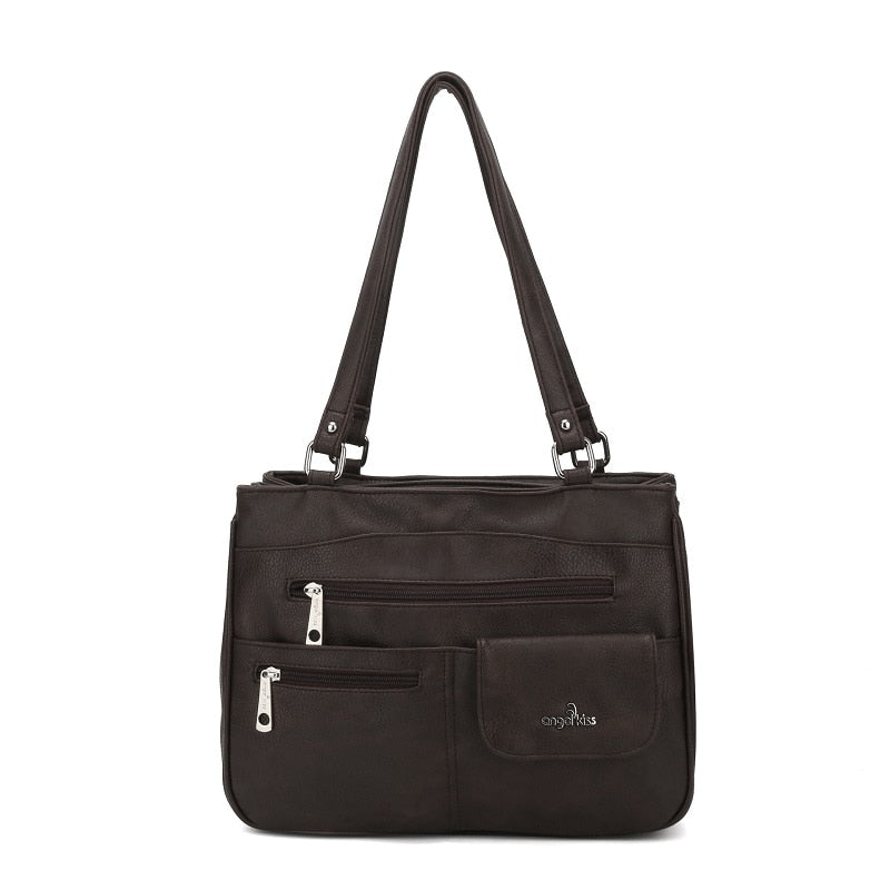 Woman wearing a stylish multi-compartment FlexiCarry crossbody bag.