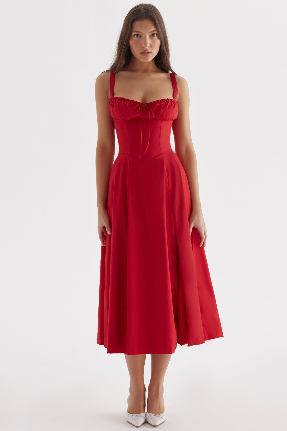 Woman confidently wearing an elegant floral bustier waist-shaping dress, perfect for a party.