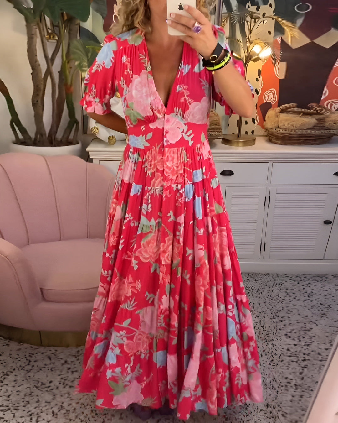 Model wearing a women's floral print V-neck A-line dress with pockets, showcasing its flattering fit.