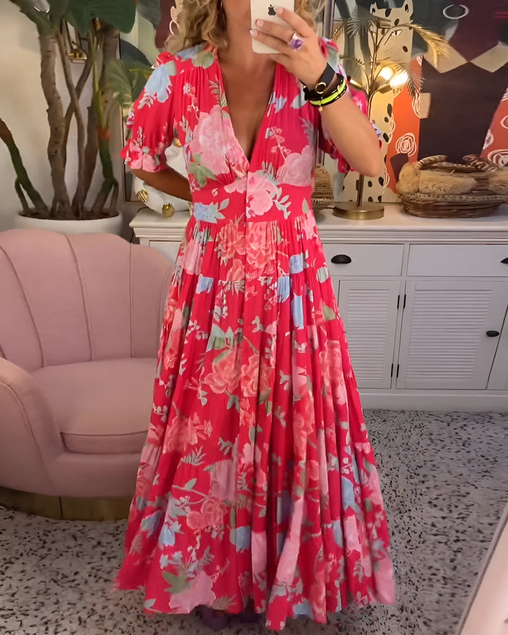 Model wearing a women's floral print V-neck A-line dress with pockets, showcasing its flattering fit.