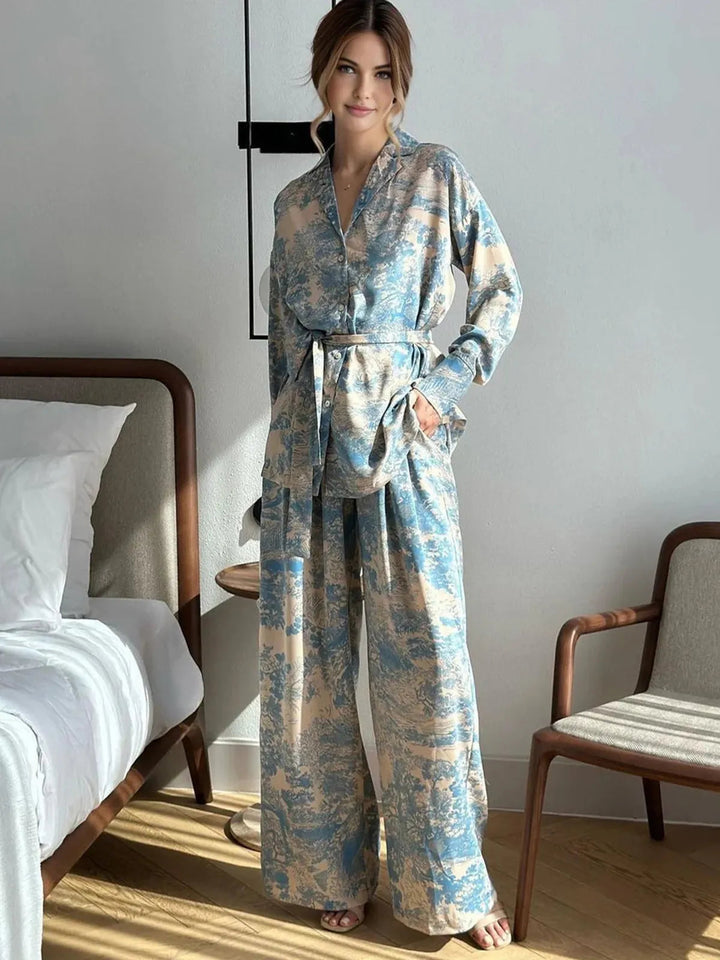 Matching two-piece women's floral print set. Relaxed fit top & wide leg pants for a comfortable, stylish look.