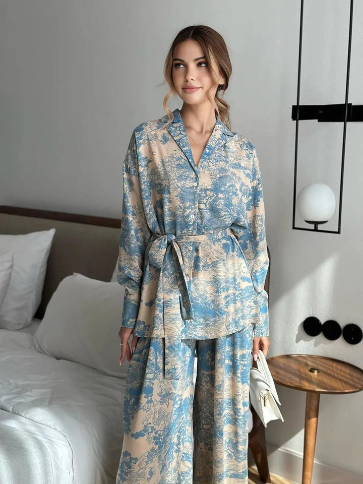 Stylish women's floral print co-ord set: a relaxed fit top paired with comfortable wide-leg pants for summer.