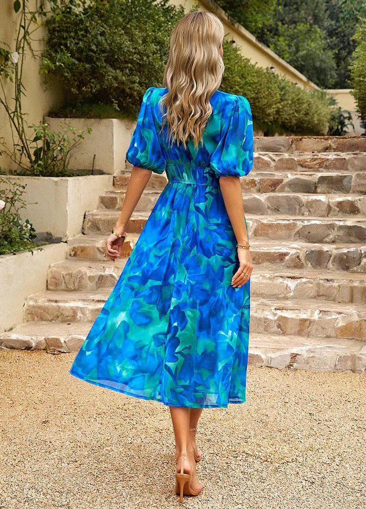 Casual women's summer midi dress featuring a beautiful floral print and a comfortable, flowing design.