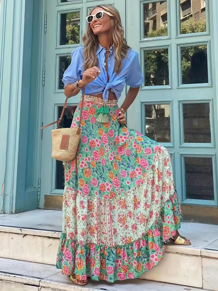 Comfortable women's flowing tiered maxi skirt, embodying a relaxed bohemian summer style.