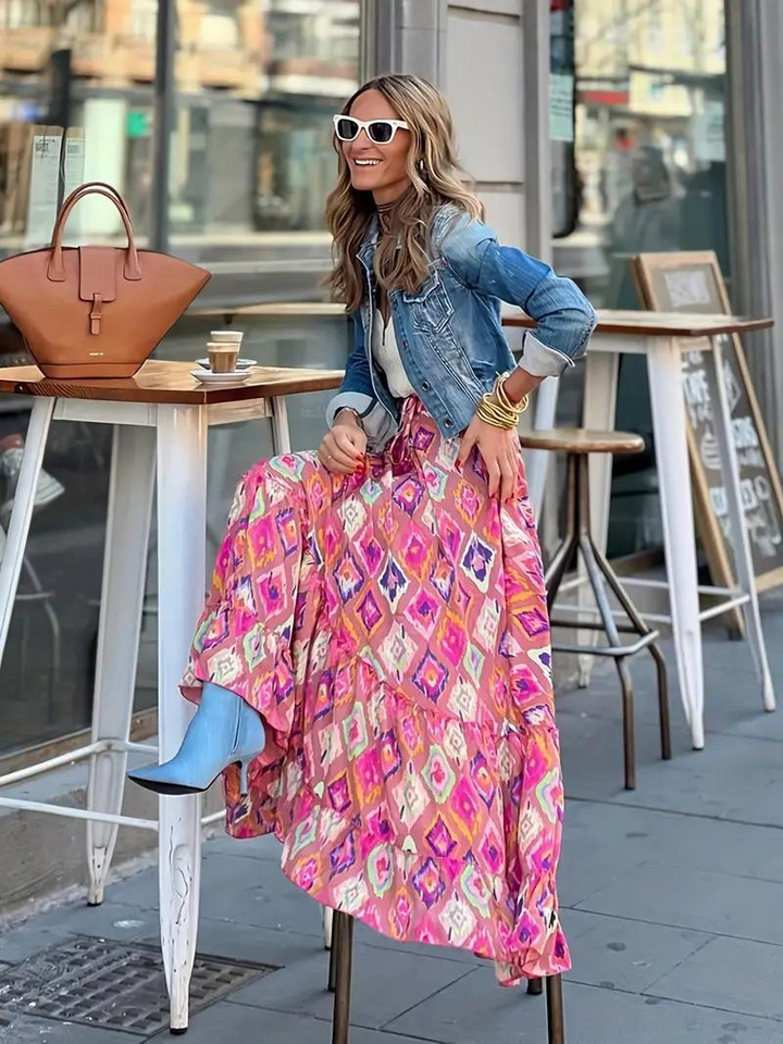 Stylish women's tiered maxi skirt, offering a flowing boho summer look.